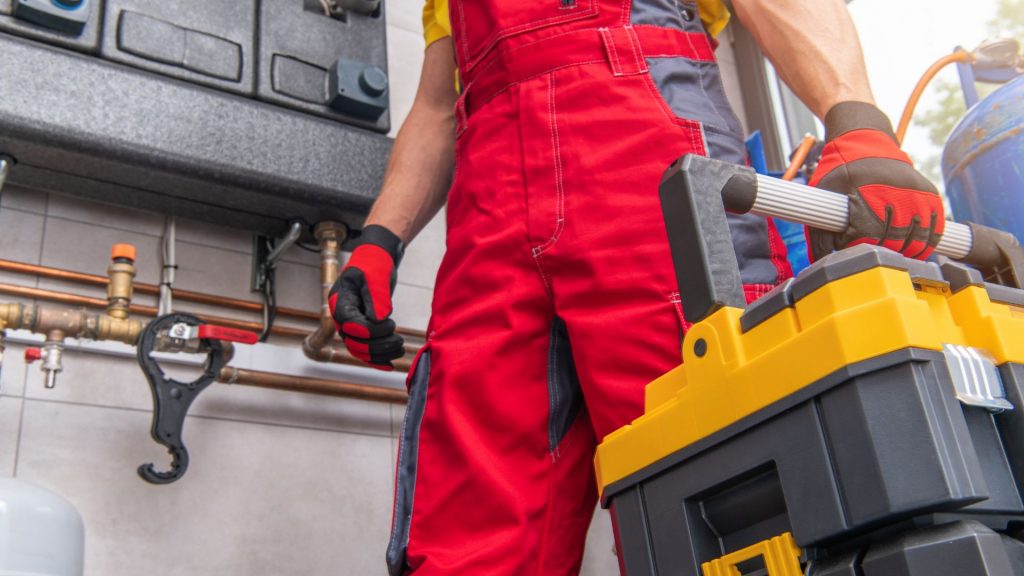 A technician holding a tool box